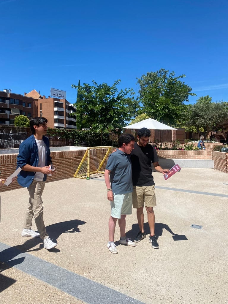 Sharing one of the finished storybooks outside Fundación Caná